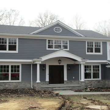 Two-Story Transitional Colonial with Stone Foundation and Gable Porch