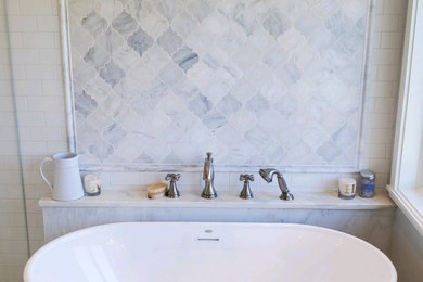 Example of a large trendy master marble floor and gray floor bathroom design in Minneapolis with gray walls, marble countertops, a hinged shower door, gray countertops and a freestanding vanity