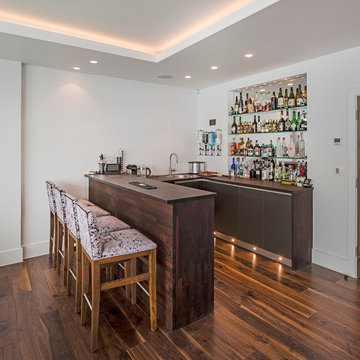 In the corner of the games/family room, a home bar.