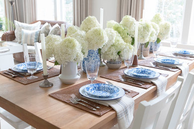 Inspiration for a transitional dining room in New York with white walls.