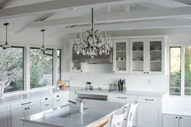 Example of a transitional l-shaped kitchen design in Seattle with an undermount sink, recessed-panel cabinets and white cabinets