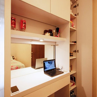 This is an example of a mid-sized modern master bedroom in Other with yellow walls and vinyl floors.