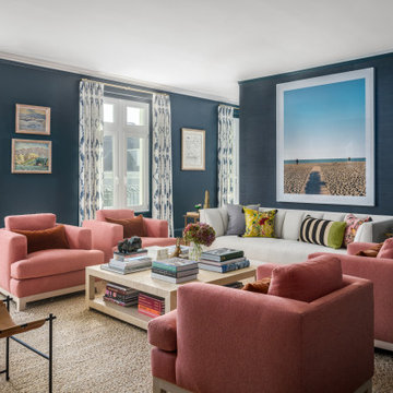 Living Room with Teal Walls, White Sofa, and Pink Armchairs
