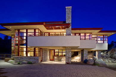 Mid-sized trendy beige two-story stone exterior home photo in Phoenix