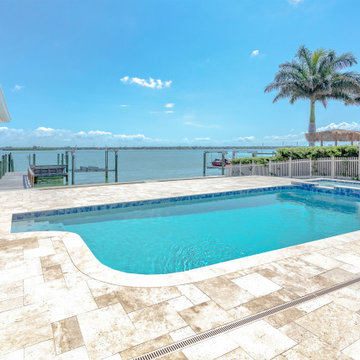 Contemporary Waterfront Pool Retreat with Expansive Dockside Views