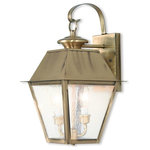 Livex Lighting Lights - Mansfield Outdoor Wall Lantern, Antique Brass - Illuminate a driveway or terrace area with the Mansfield Wall Lantern. Modeled on traditional, Victorian-style lamps, it features a bronze shade with seeded glass panels suspended from a curved mount. The lantern is weatherproof and makes an elegant addition to an exterior wall or porch.
