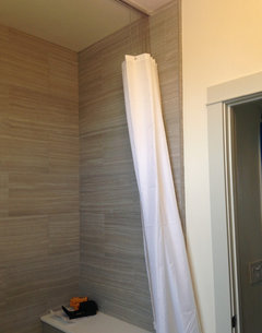 Anyone seen a modern-looking shower curtain holdback?