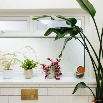 Pink & green bathroom with mix of tiles & patterns