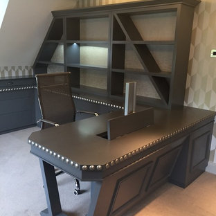 Inspiration for a medium sized modern study in West Midlands with grey walls, carpet, a built-in desk and grey floors.