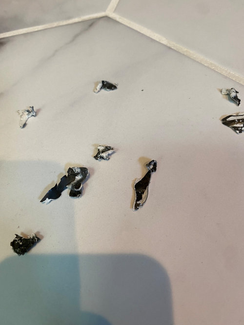 Horrible smelling caulk in shower drain system?