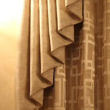 Swags overlaying pinch pleated curtains