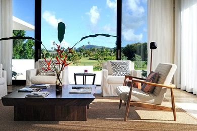 Large trendy open concept medium tone wood floor family room photo in Denver with white walls