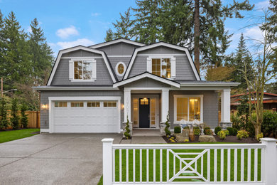 Beach style gray two-story shingle house exterior photo in Seattle with a black roof