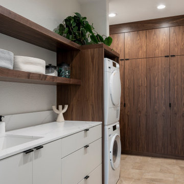 Floor to Ceiling Walnut Cabinets in Contemporary Laundry Room