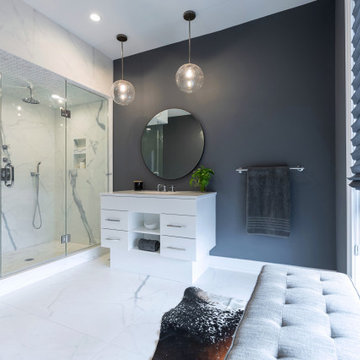Upon walking into the master bathroom, one is greeted with floor to ceiling wind
