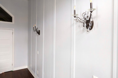 Inspiration for a transitional master wall paneling bedroom remodel in Toronto with white walls