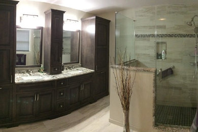 Inspiration for a master multicolored tile and glass sheet porcelain tile bathroom remodel in Philadelphia with an undermount sink, beaded inset cabinets, granite countertops and black walls
