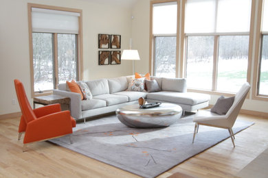 Large trendy open concept carpeted living room photo in Cleveland with white walls
