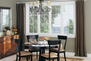 Example of a mid-sized classic enclosed dining room design in Houston with green walls