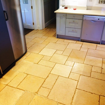Deep clean and seal of a dirty Limestone tiled kitchen floor in Icklesham