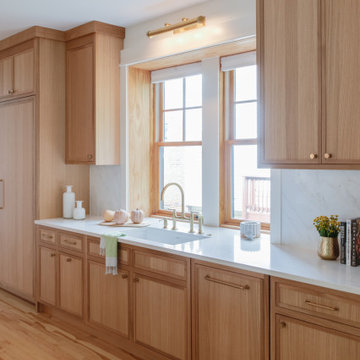 Warm Modern Kitchen Renovation with Natural Oak & Green Accents