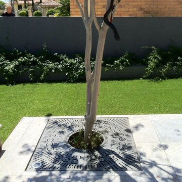 Orbit Tree Grate with Light Port at a Private Residence