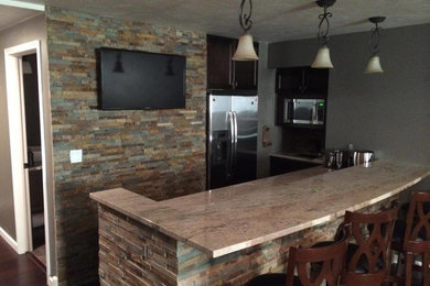 Inspiration for a basement remodel in Other with a stone fireplace
