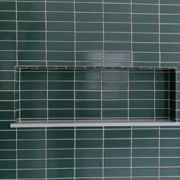Blue-Green Shower Tile and Hexagon Floor Tile Bathroom