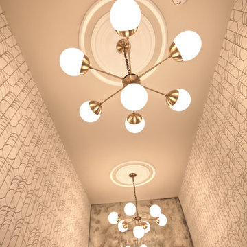 Bombazine lighting echoed in huge antiqued mirrors
