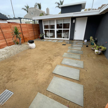 Concrete steps , decomposed granite and wooden fence