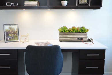 Example of a mid-sized freestanding desk study room design in New York