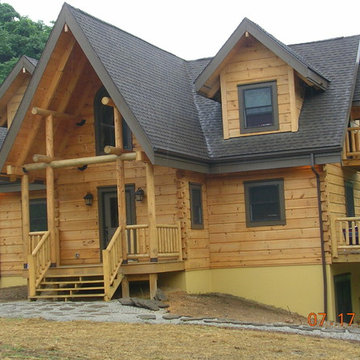 Log Home Entry Porch with Round Timbers