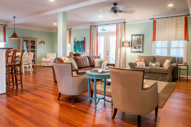 Example of a classic open concept living room design in Charleston
