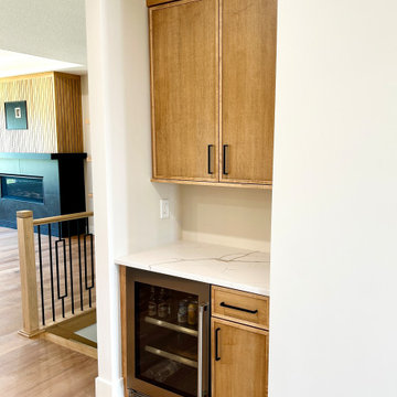 Maple Pecan Stain and Painted Black Kitchen Design in Bettendorf, Iowa