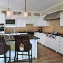 White cabinets brick splash