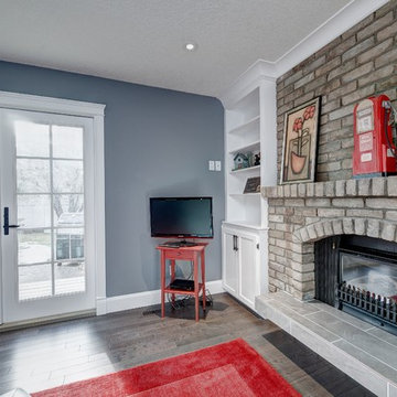 Home office space with Chicago brick fireplace facade and raised tile hearth wit