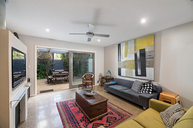 Example of a trendy living room design in Melbourne