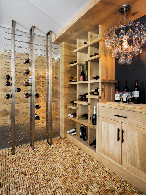 Eclectic Wine Cellar Cork Example of a trendy wine cellar design in Boston with storage racks and cork floors