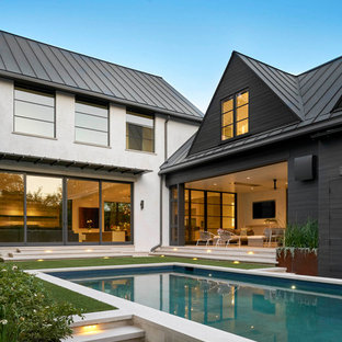 ダラスの大きい長方形コンテンポラリースタイルのおしゃれなプール (コンクリート敷き	) の写真