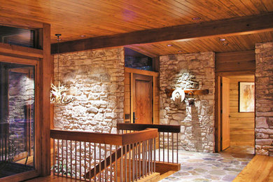 Staircase - large southwestern wooden u-shaped wood railing staircase idea in Austin with wooden risers