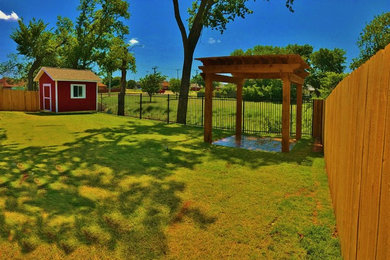 Photo of a backyard brick retaining wall landscape in Oklahoma City.