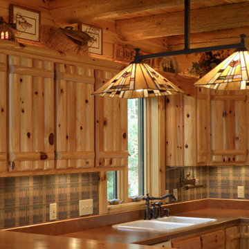 Knotty pine log upper cabinets, knotty pine log rafters, and knotty pine tongue