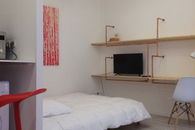 Example of a small danish linoleum floor and gray floor bedroom design in Nice with white walls