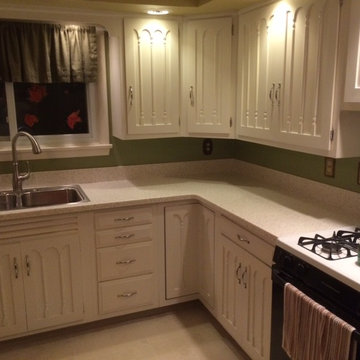 After pictures of new Solid Surface Countertops, Sink, and Faucet