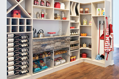 Example of a large cottage l-shaped dark wood floor and brown floor kitchen pantry design in Tampa with no island, open cabinets and white cabinets