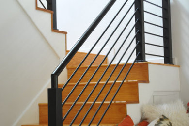 Example of a small trendy wooden l-shaped mixed material railing staircase design in New York with wooden risers