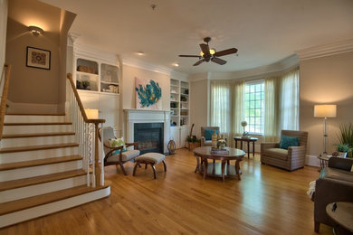 Inspiration for a mid-sized transitional formal and enclosed light wood floor and brown floor living room remodel in Raleigh with beige walls, a standard fireplace and no tv