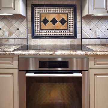 Traditional Chef's Kitchen with Ivory Cabinets & Natural Stone Backsplash