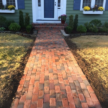 Brick walkway and front yard garden