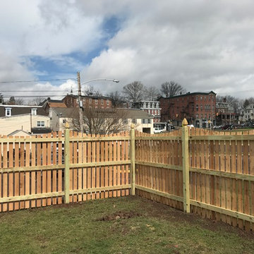 Western Red Cedar Spaced picket fence with French gothic posts and Concave Top